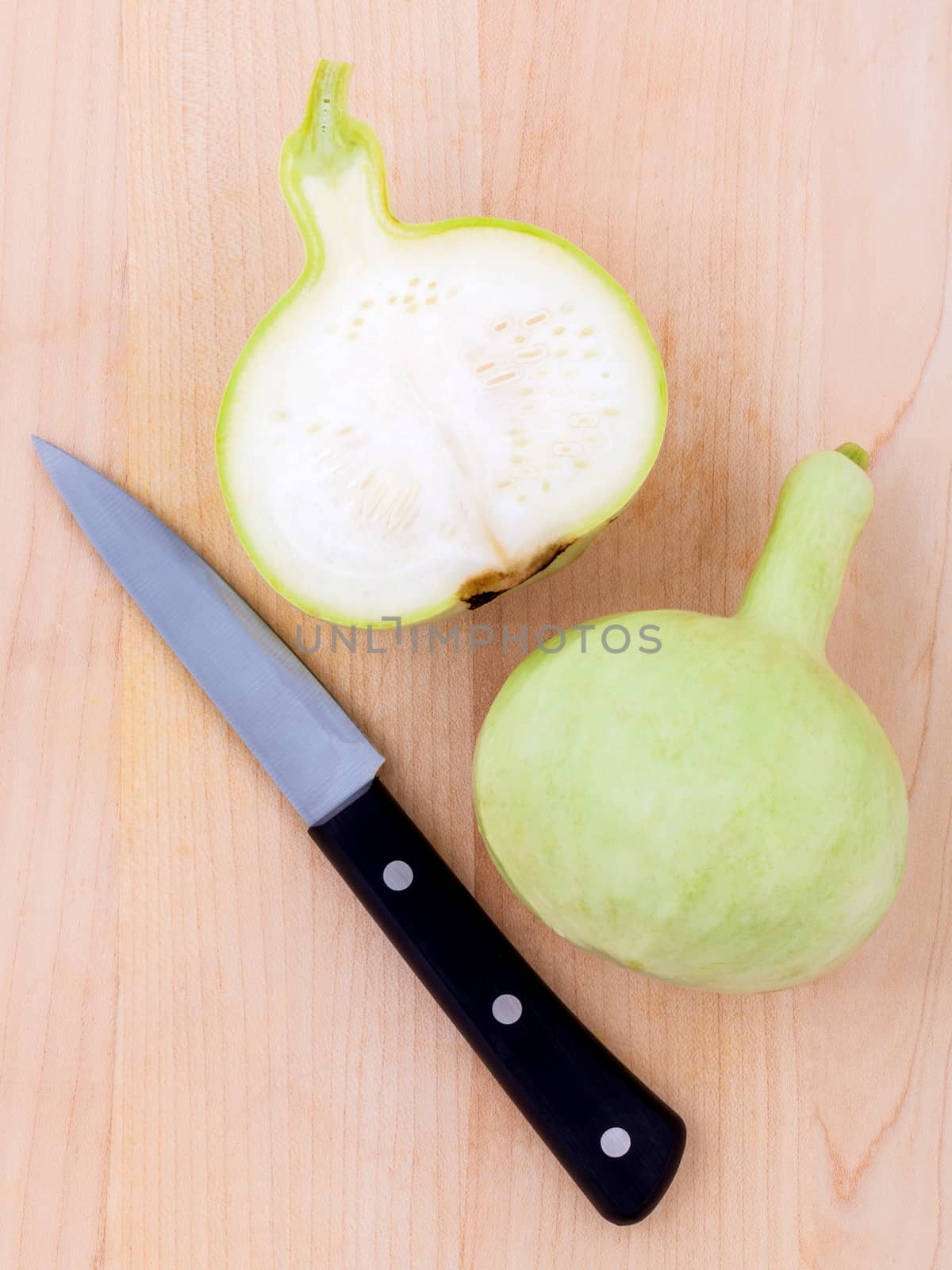 Halved bottle gourd,calabash gourd ,flowered gourd on wooden