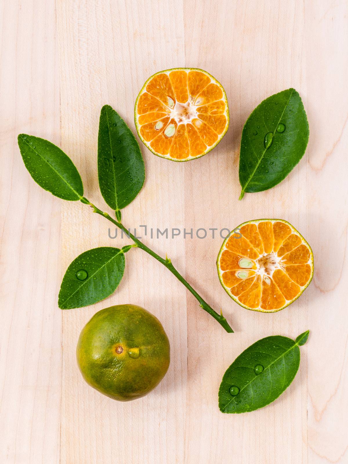 Fresh oranges and orange slice on wooden background with orange  by kerdkanno