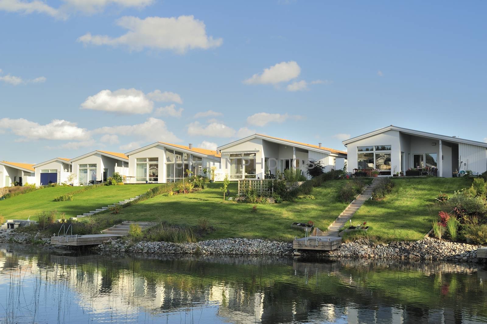 Homes with Pond. Scene of prime real estate community. Living in serenity.