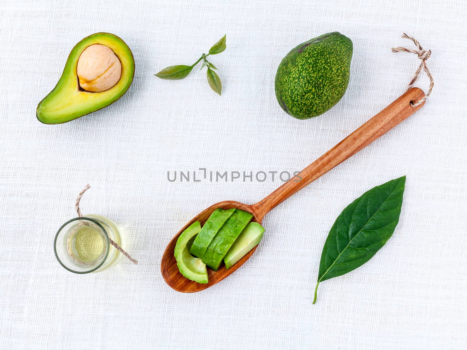 Avocado oil on the white table background clean and healthy conc by kerdkanno