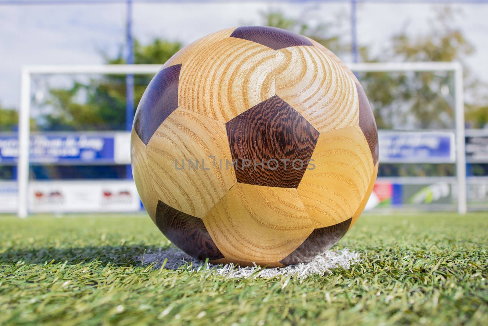 football lying on penalty spot with goal in background