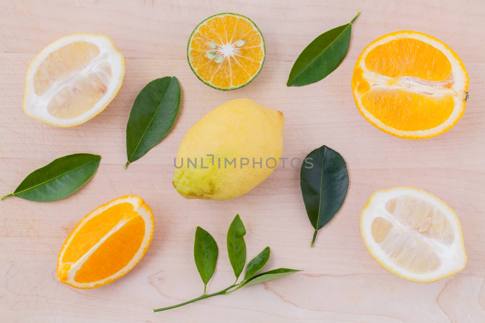 Mixed citruses fruit oranges, lemon on wooden background with or by kerdkanno