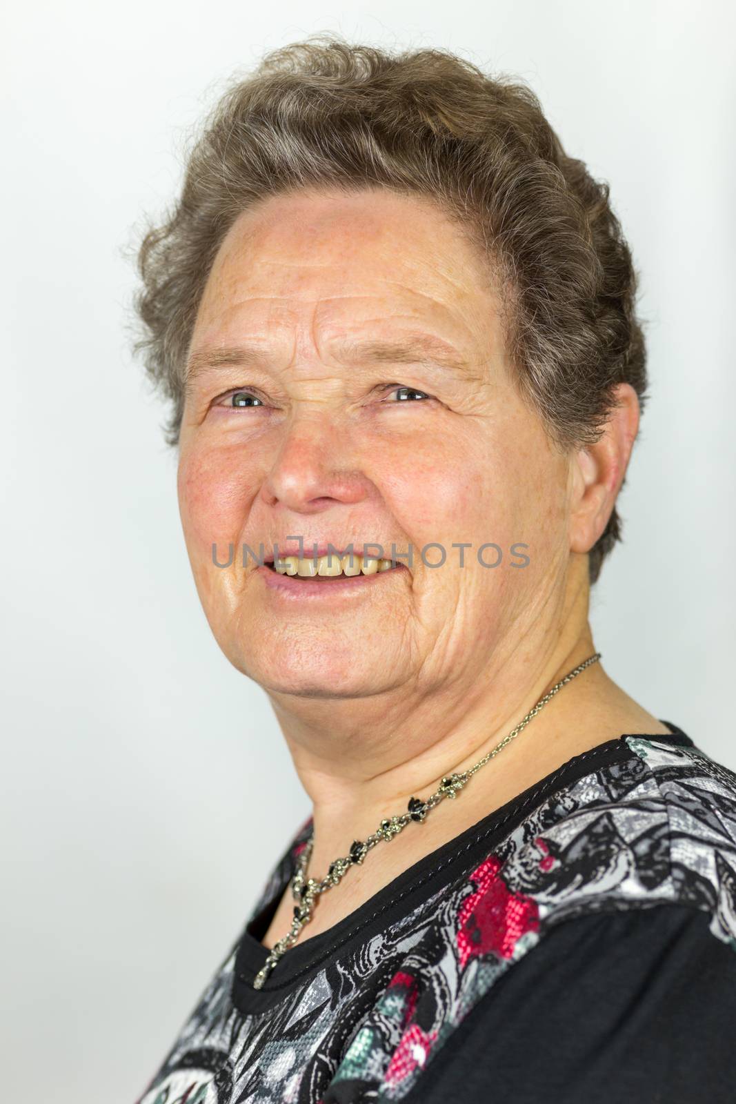 Portrait of senior european woman isolated on grey background