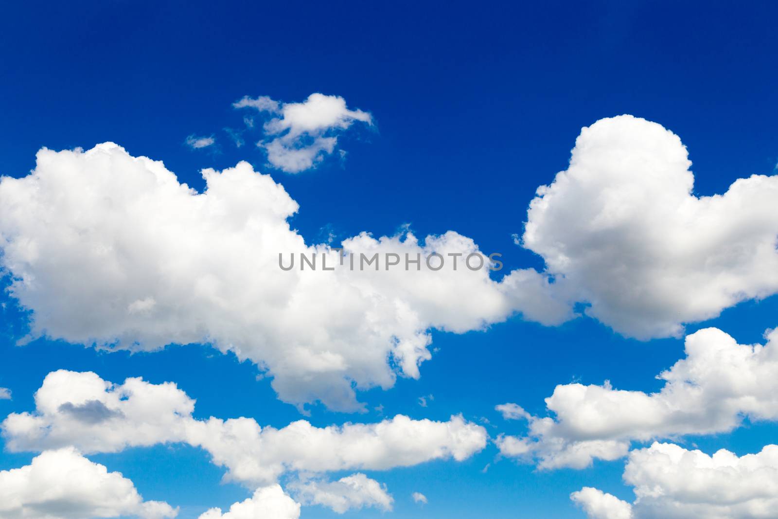 Sunny blue sky with white clouds by BenSchonewille