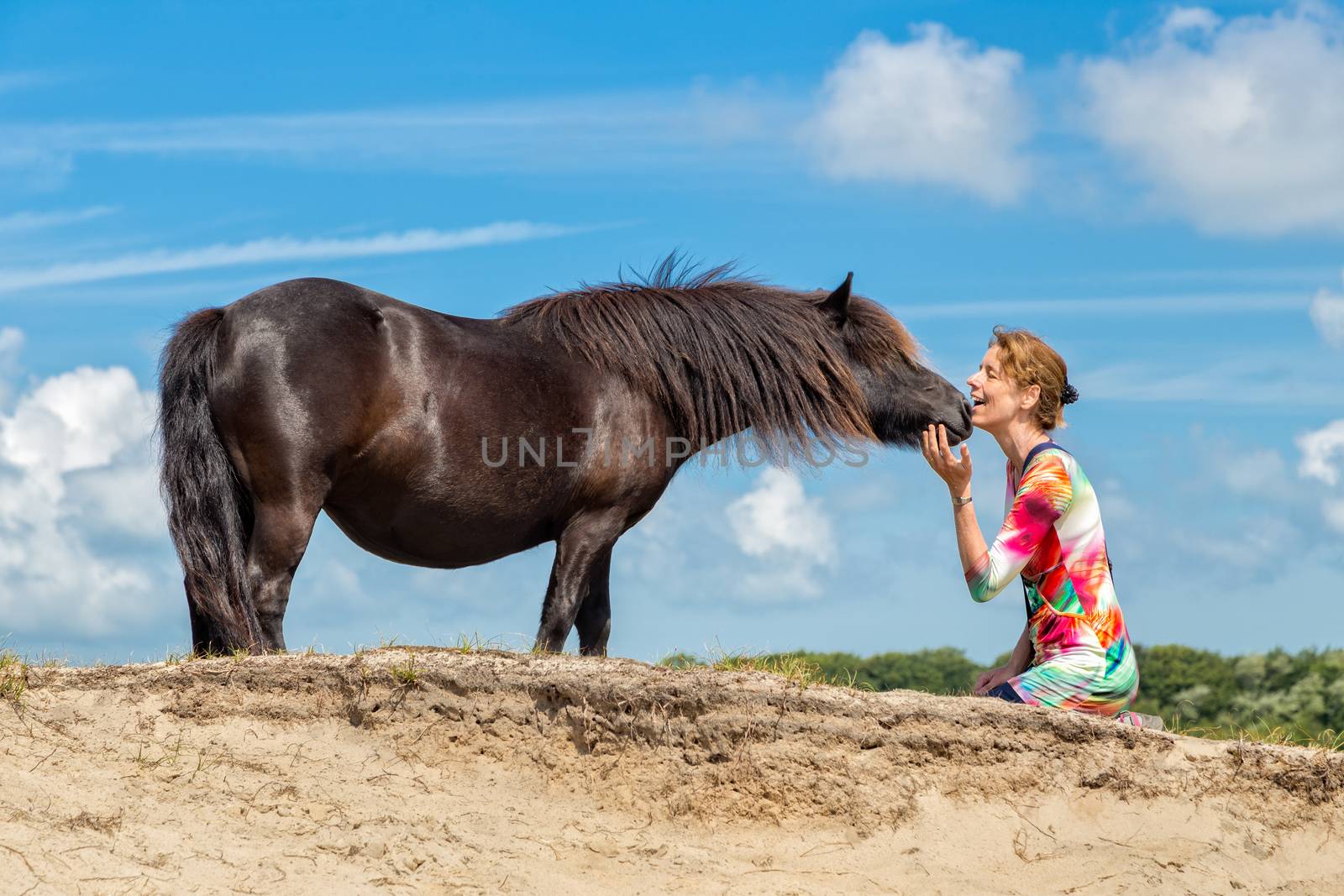 Contact woman and black pony by BenSchonewille