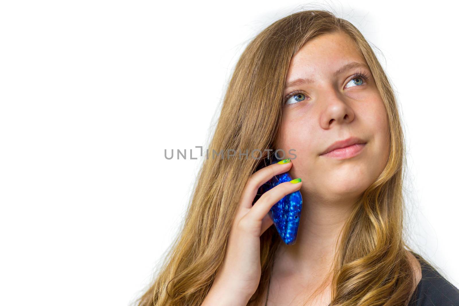 Caucasian teenage girl with long blonde hair calling with mobile telephone isolated on white background