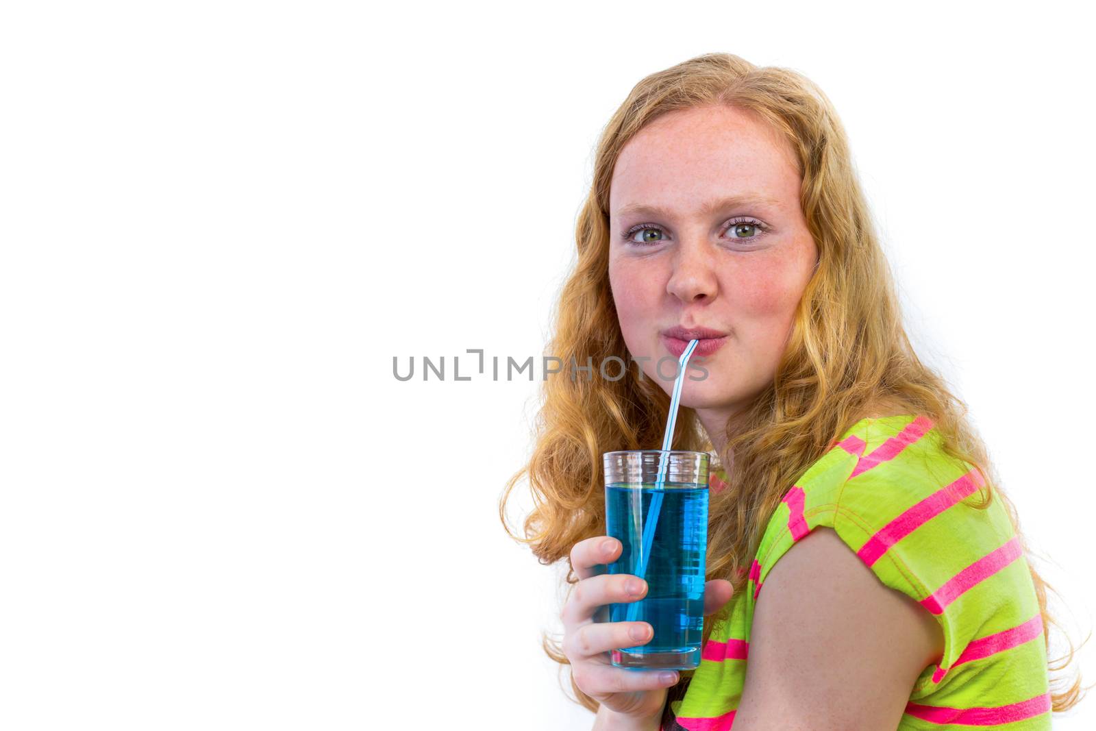 Dutch redhead teenage girl drinking blue soda with straw isolated on white background