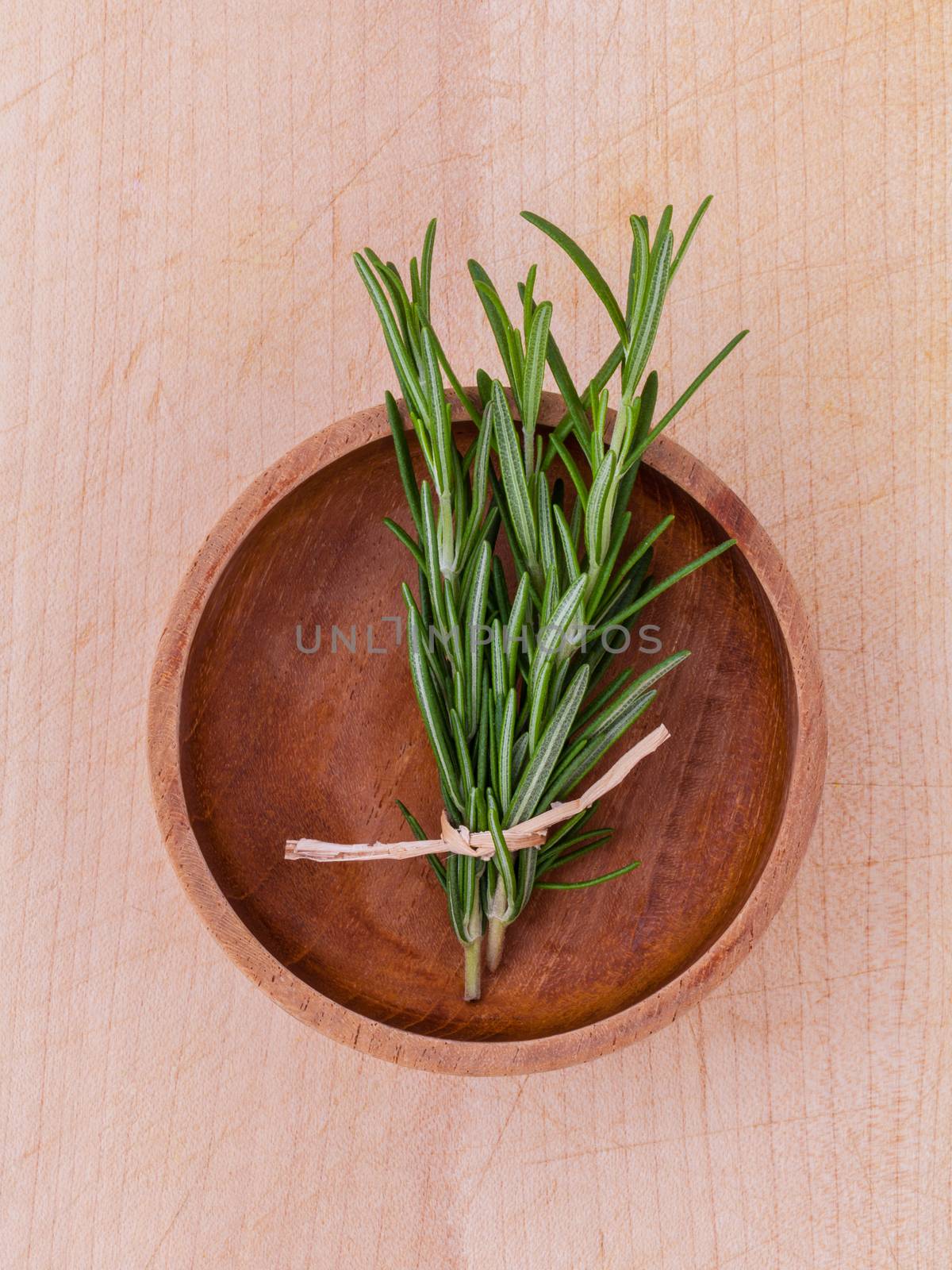 Fresh rosemary herbal medicine on wooden table