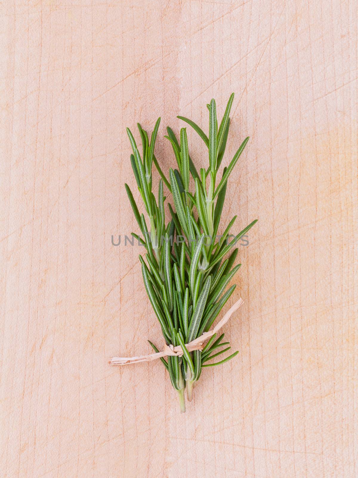 Fresh rosemary herbal medicine on wooden table