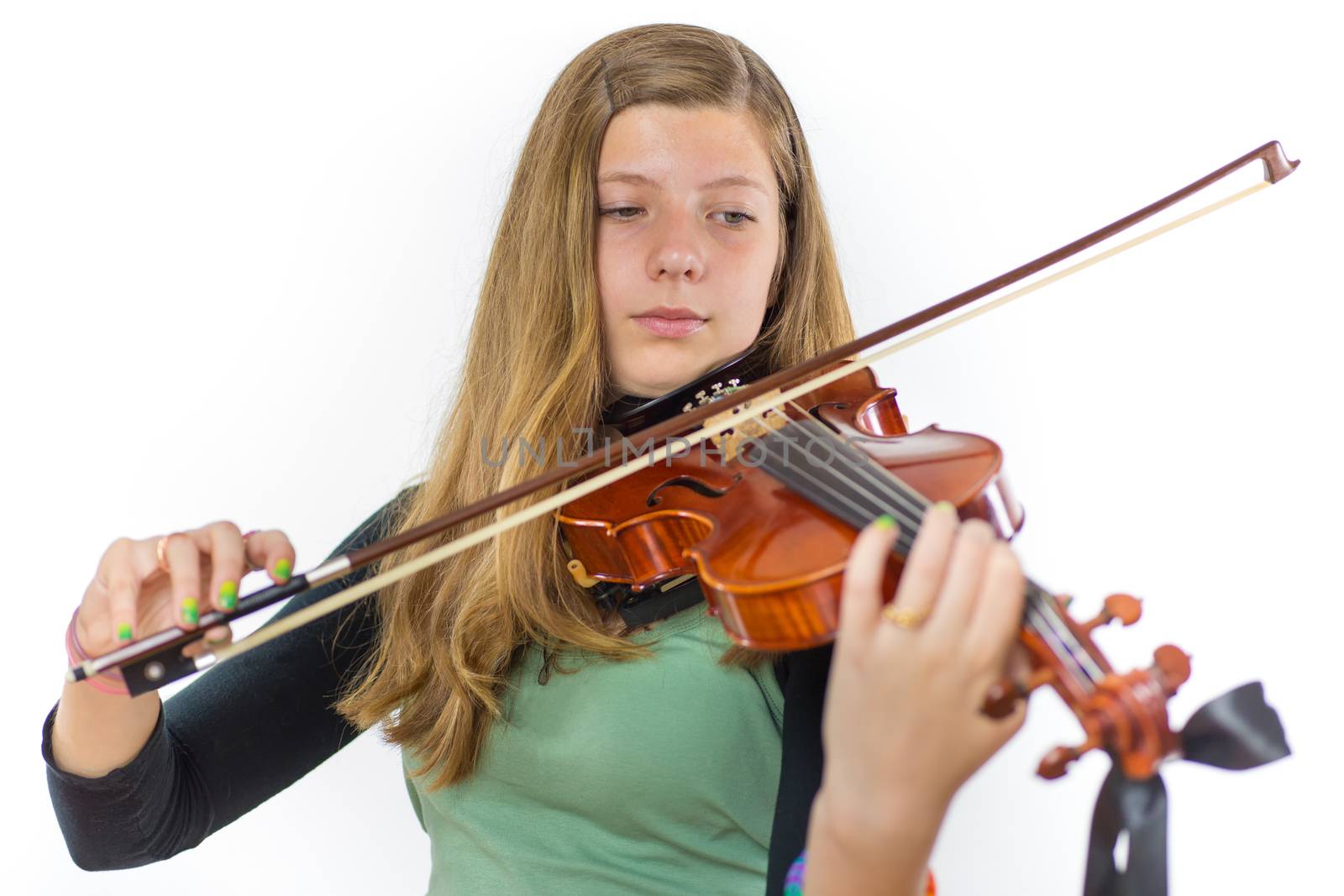 caucasian teenage girl with long blonde hair playing violin isolated on white background