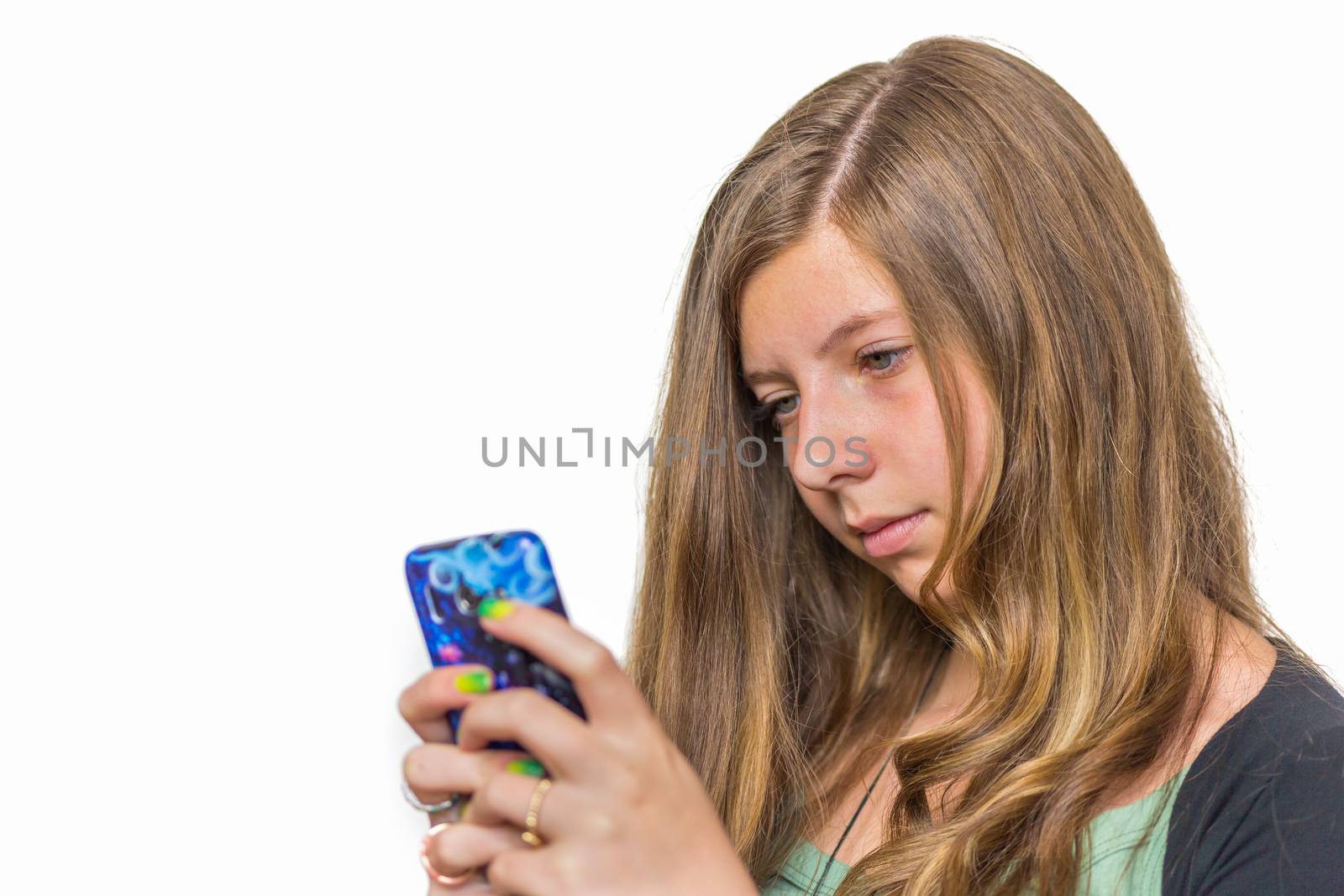 Blonde caucasian teenage girl calling with mobile telephone