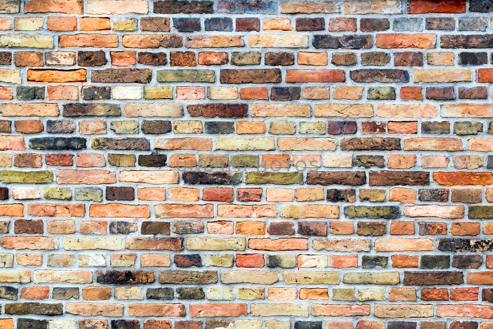 Brick wall of house with various colors