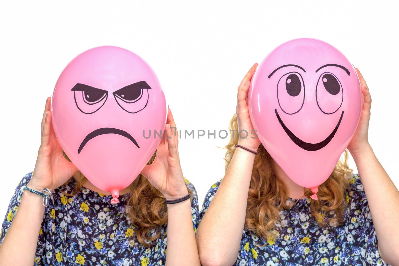 Two girls holding pink balloons with facial expressions of frustrated and smiling face isolated on white background