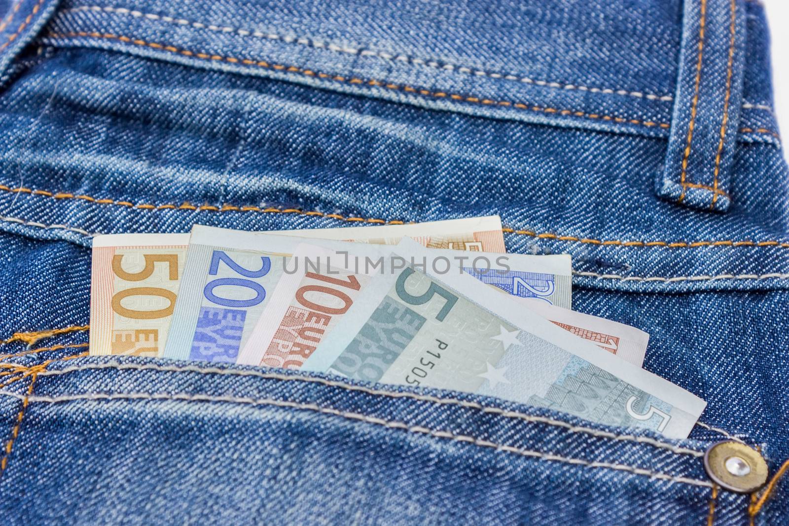 Jeans with euro bills in back pocket as symbol for money to spend