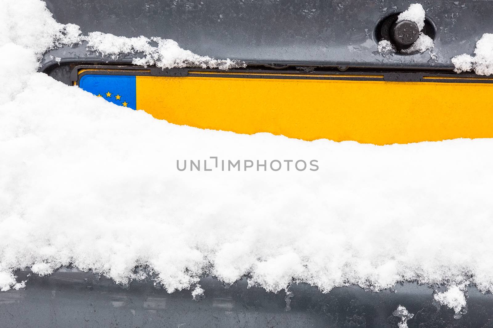 Dutch car license plate with snow in winter season