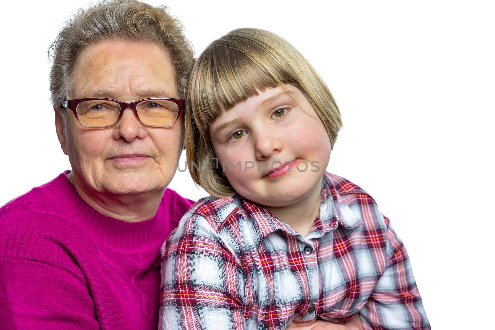 Dutch granddaughter sitting on lap of grandmother by BenSchonewille