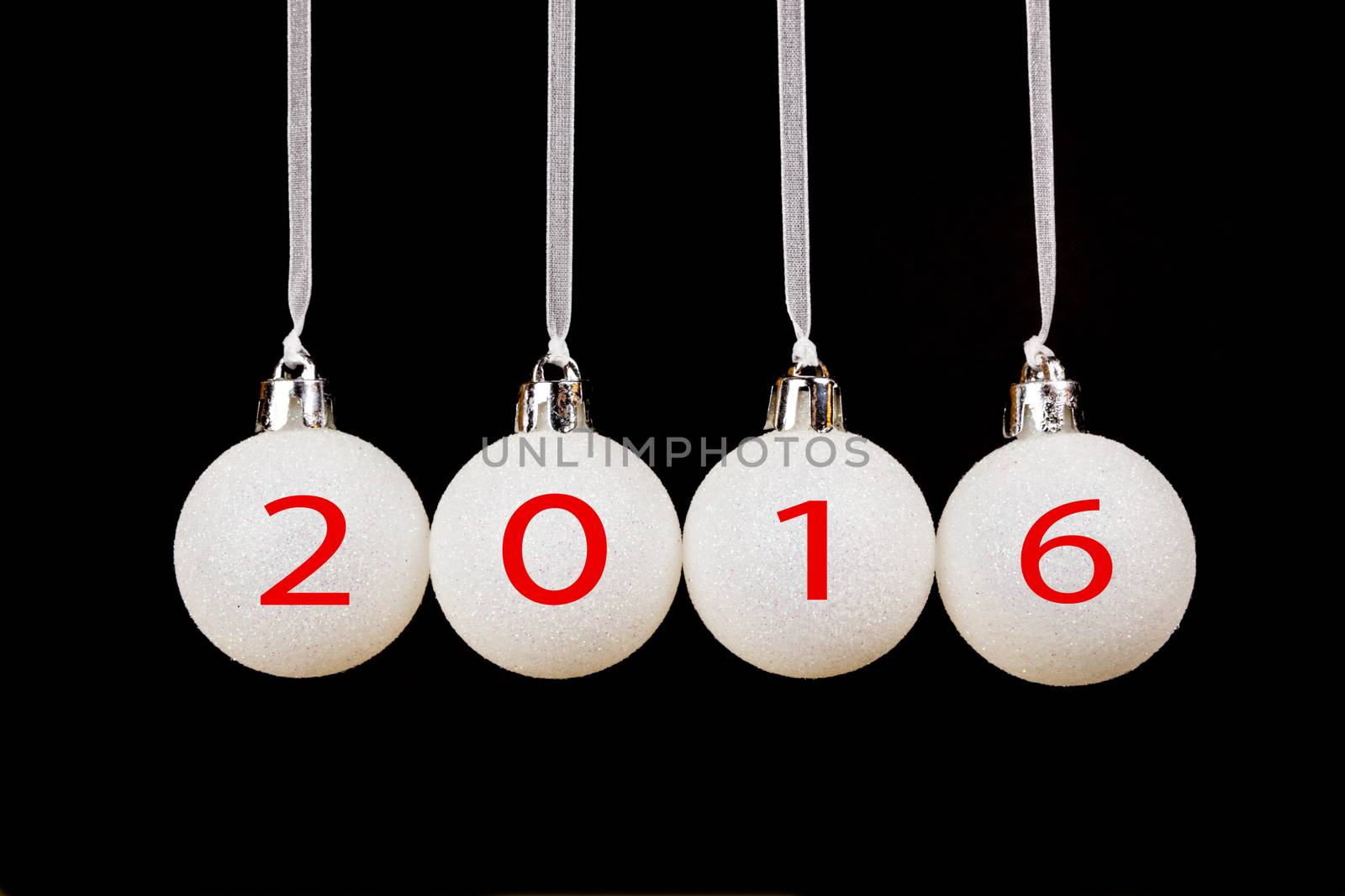 White christmas balls or baubles on black background with new year 2016