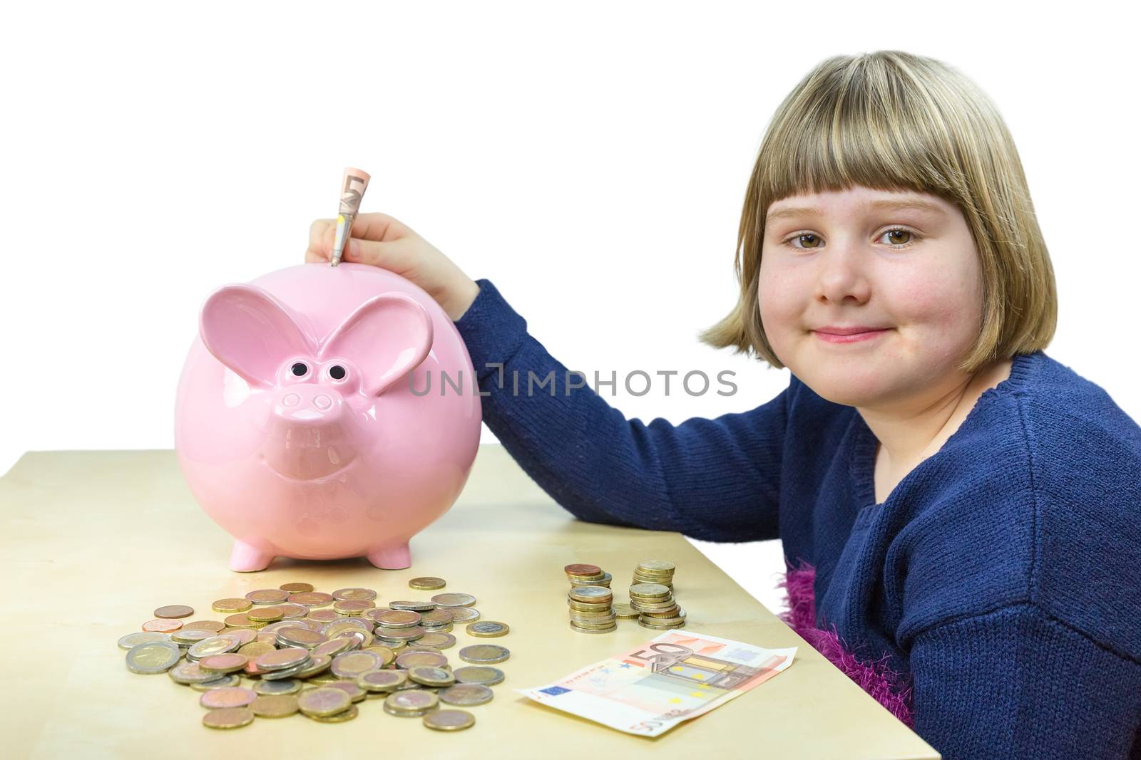 Young dutch girl with money and piggy bank by BenSchonewille