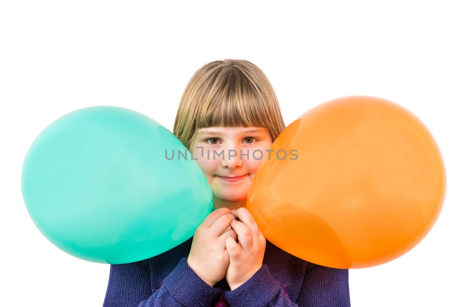 Young caucasian girl holding two colourful balloons to celebrate birthday isolated on white background