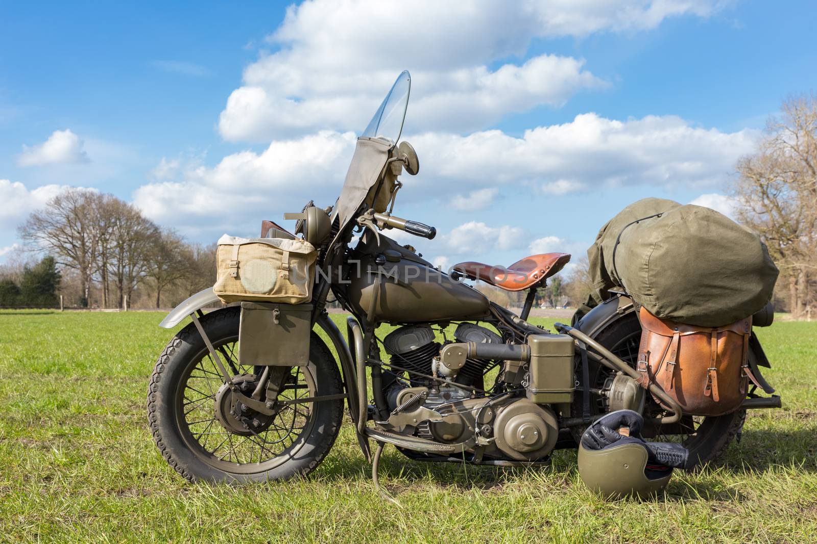 Old american military motorcycle parked on grass for exhibition in nature