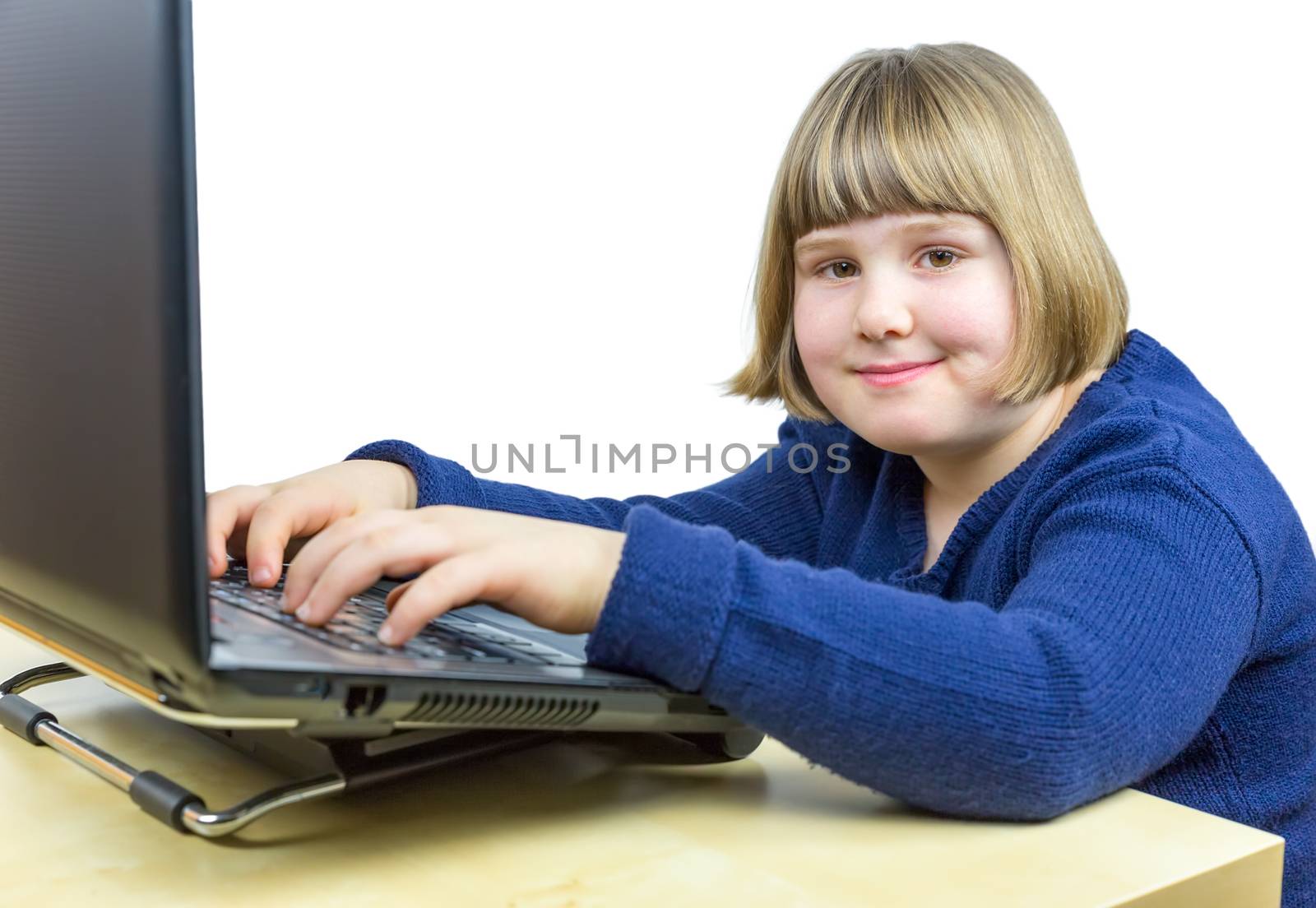 Young dutch girl working on  laptop computer by BenSchonewille