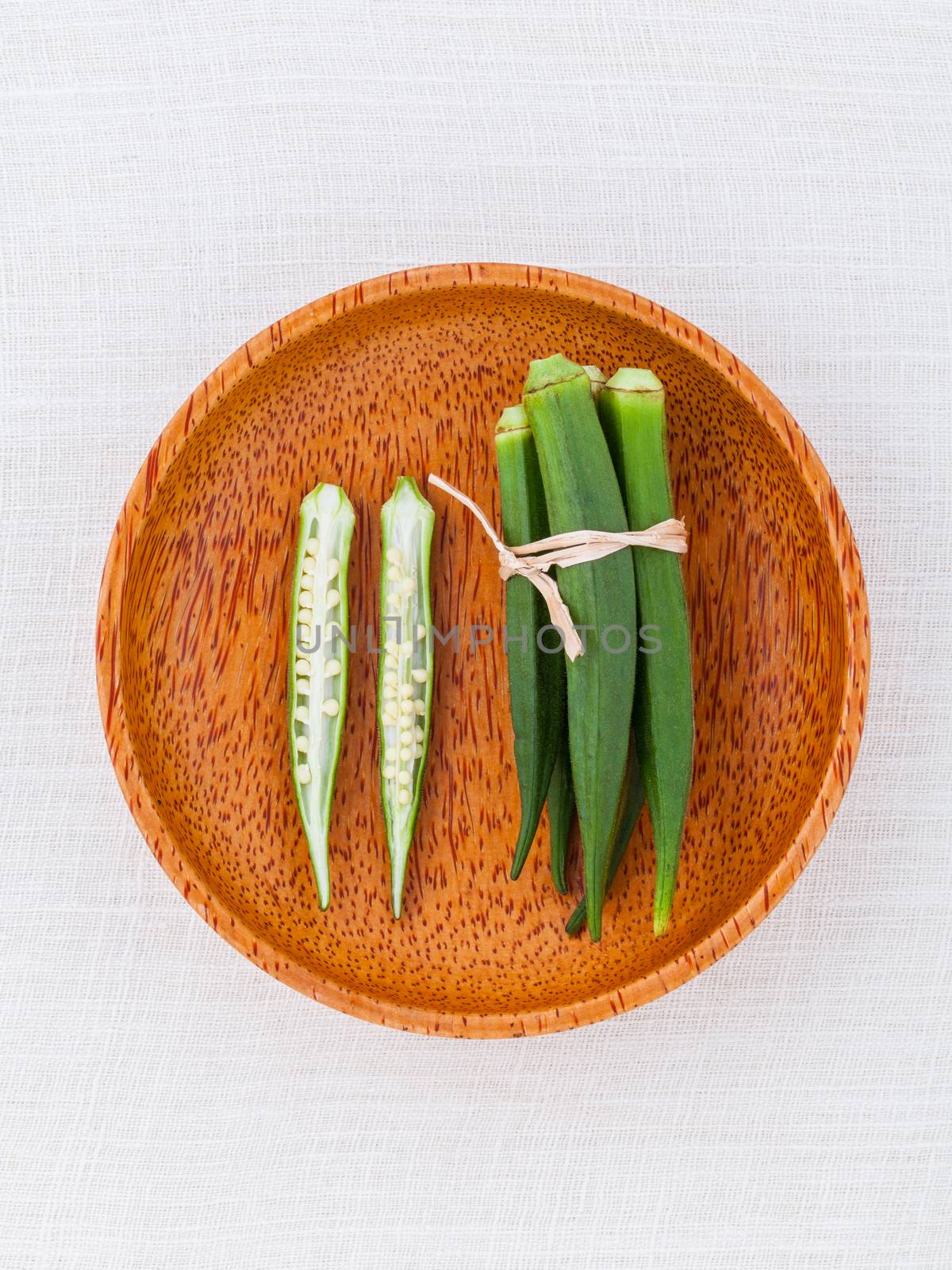Lady 's Fingers or Okra clean and healthy food on white table .