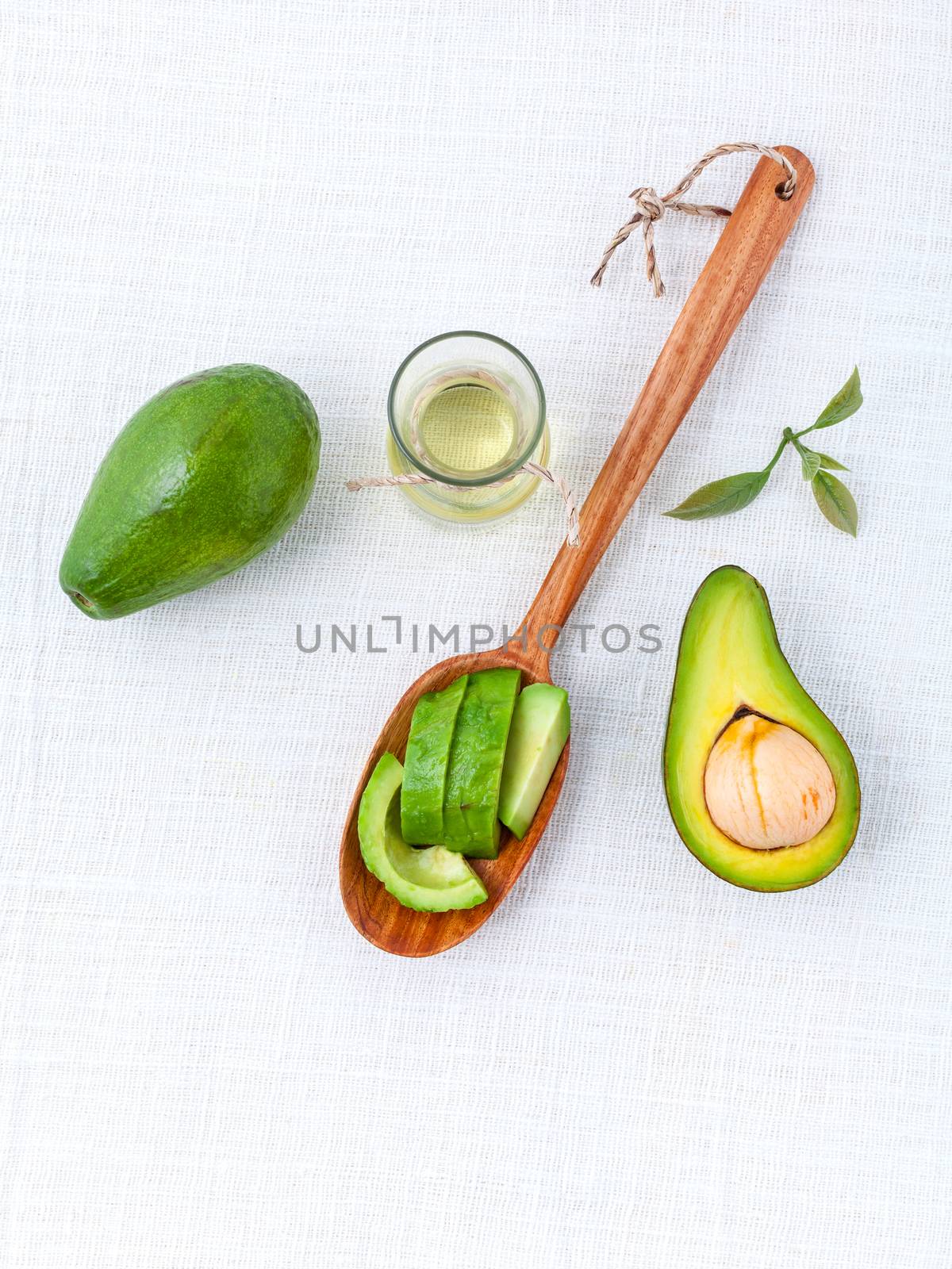 Avocado oil on the white table background clean and healthy concept.