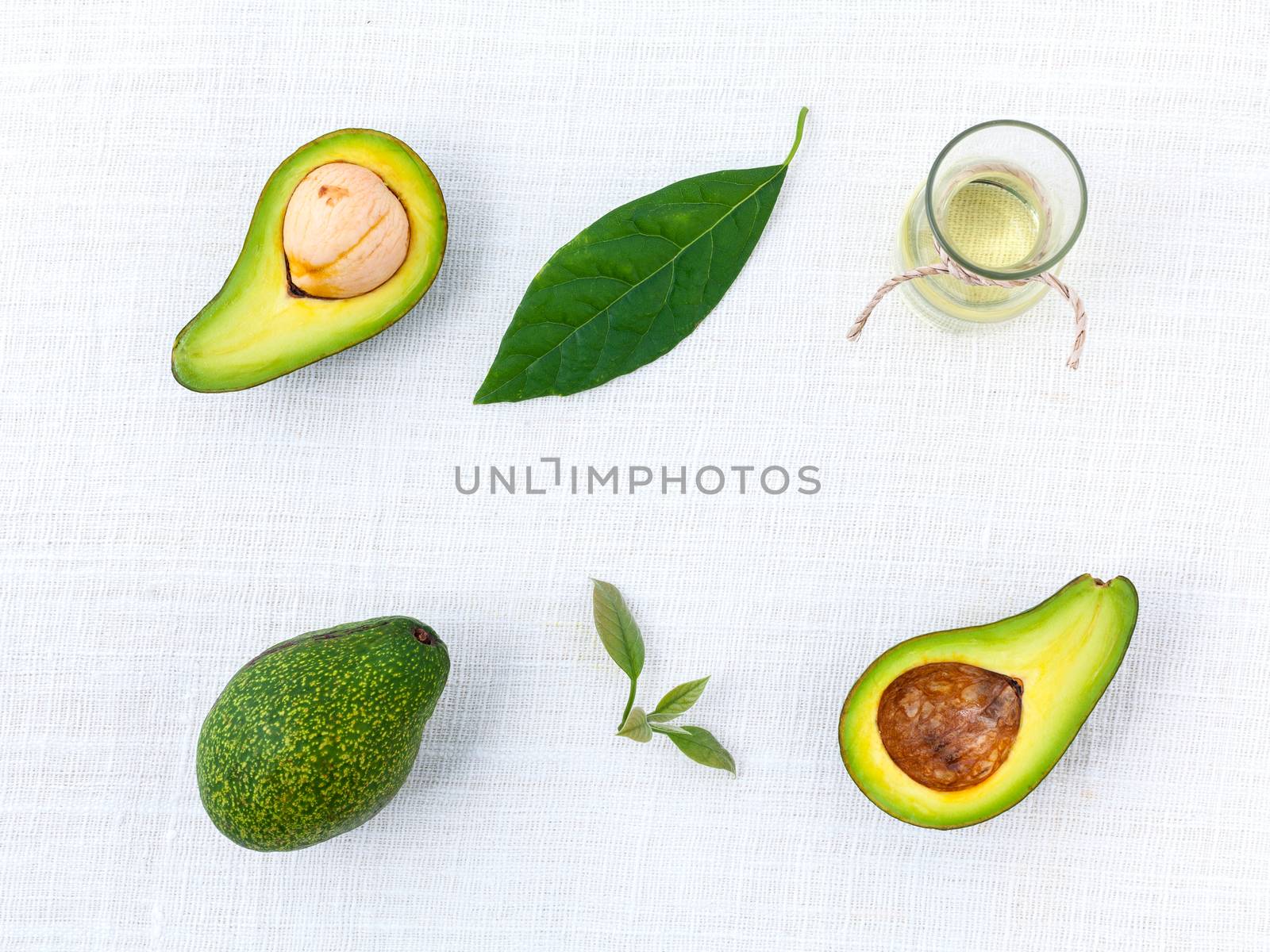 Avocado oil on the white table background clean and healthy conc by kerdkanno