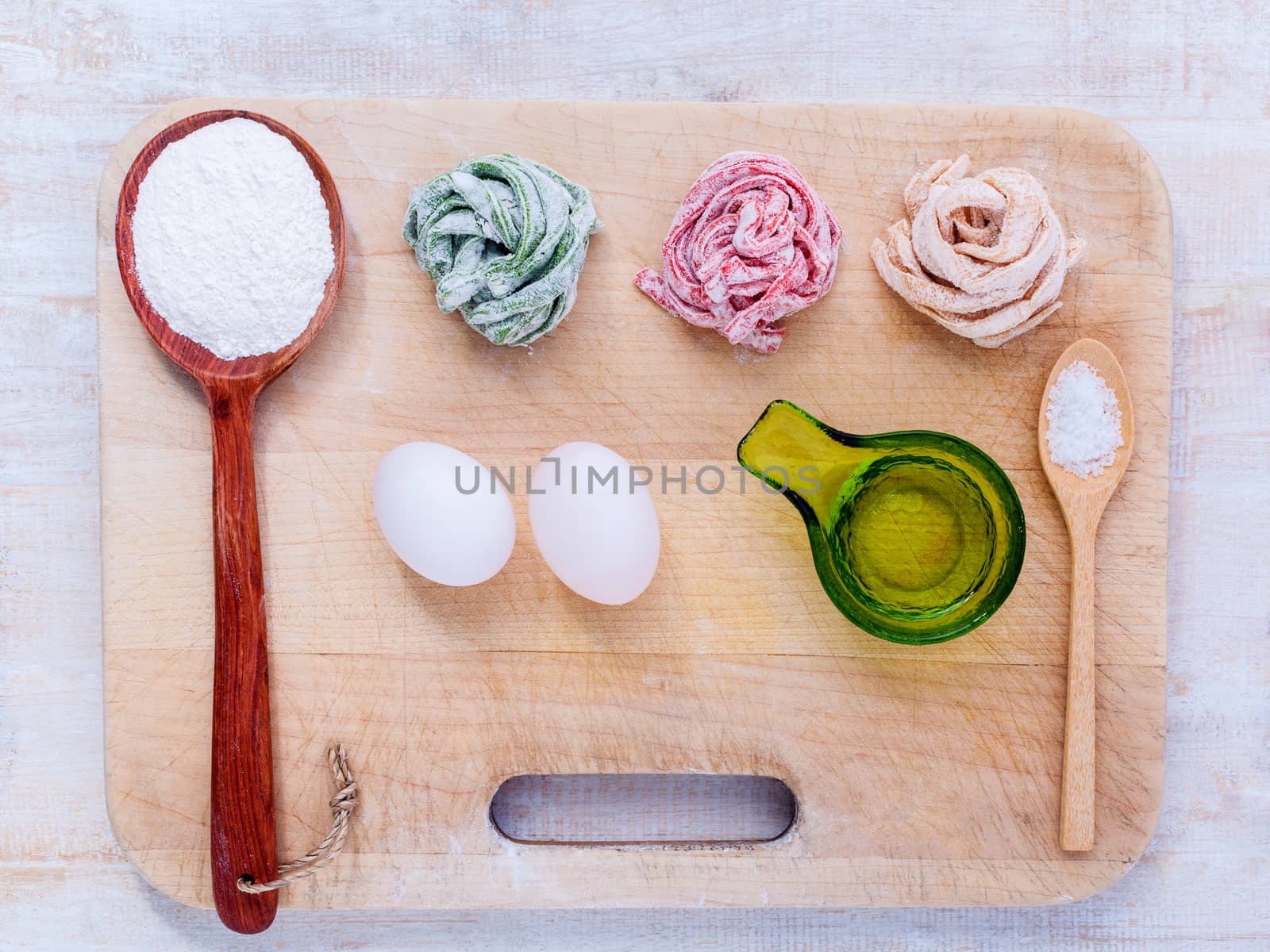 Preparation homemade pasta on wooden table.