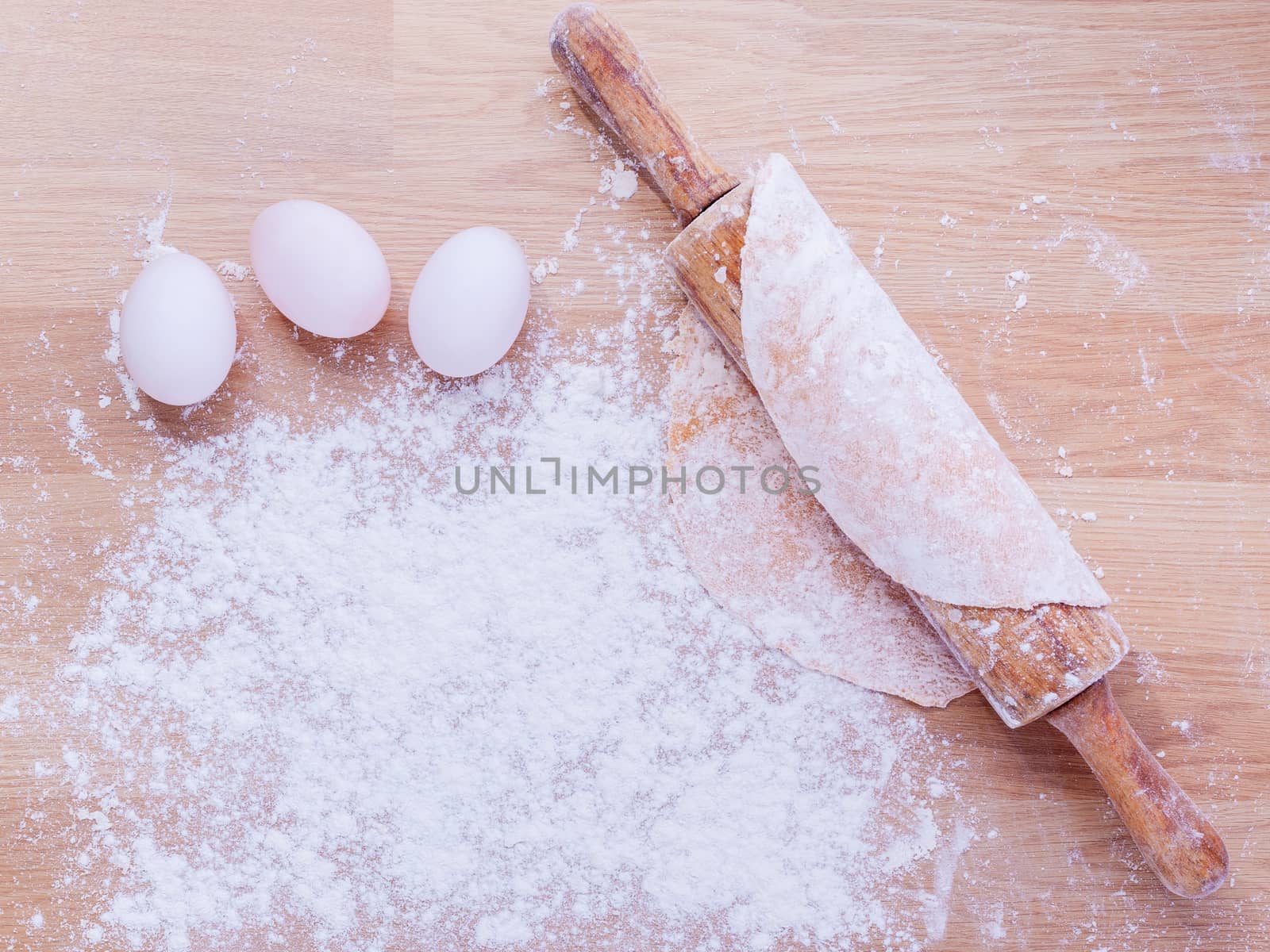 Preparation homemade pasta on wooden table.