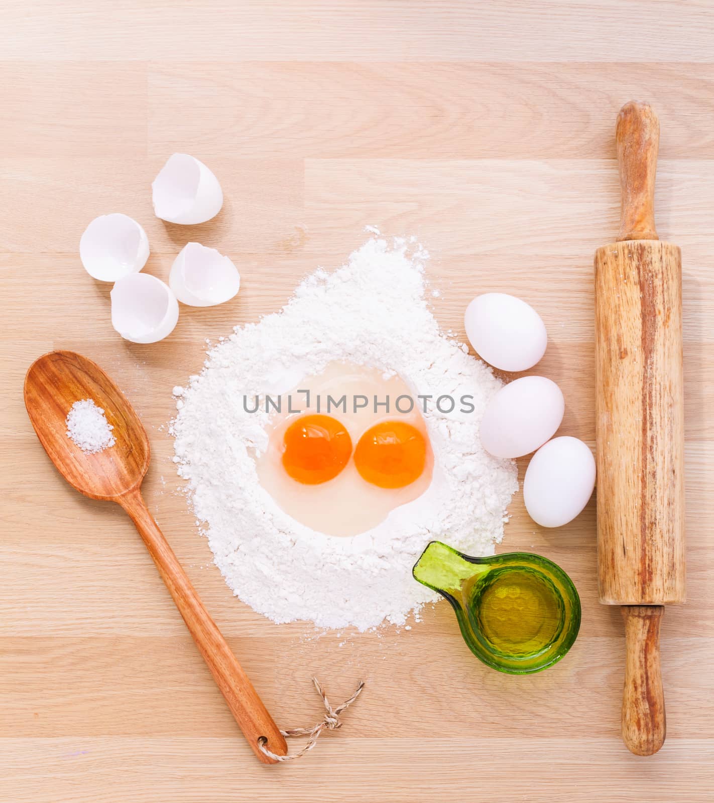 Preparation homemade pasta on wooden table.