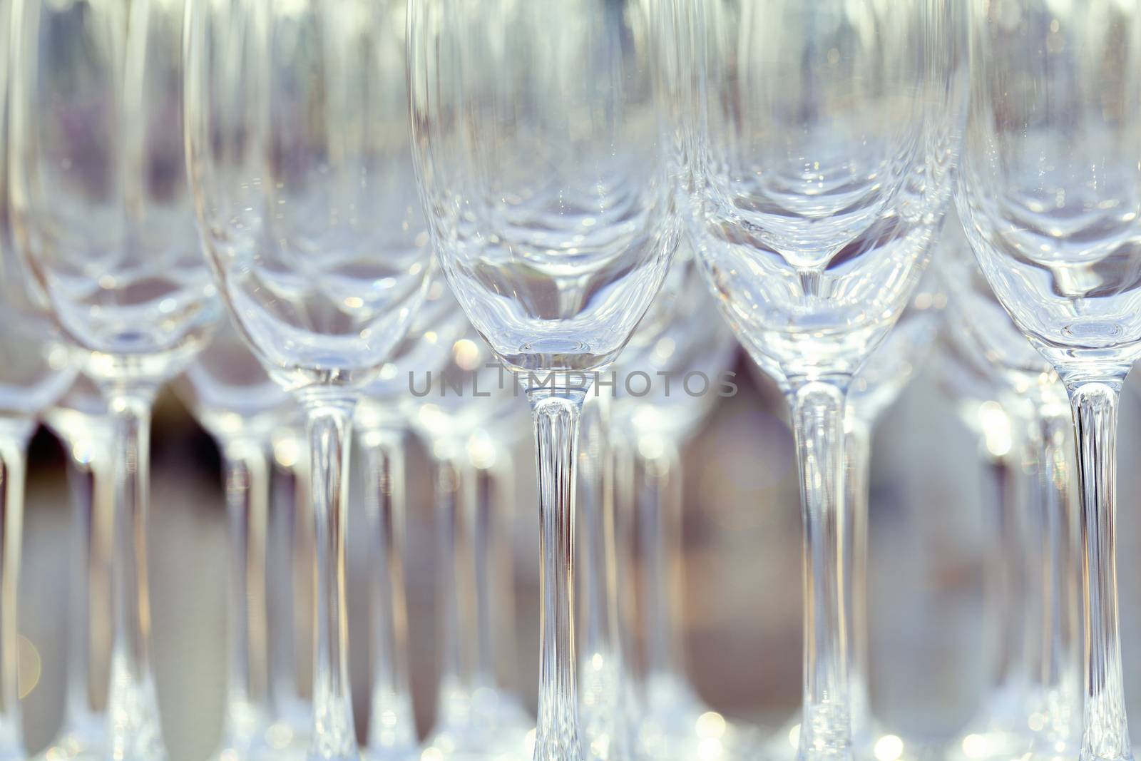 Empty wine glasses setting for wedding party.