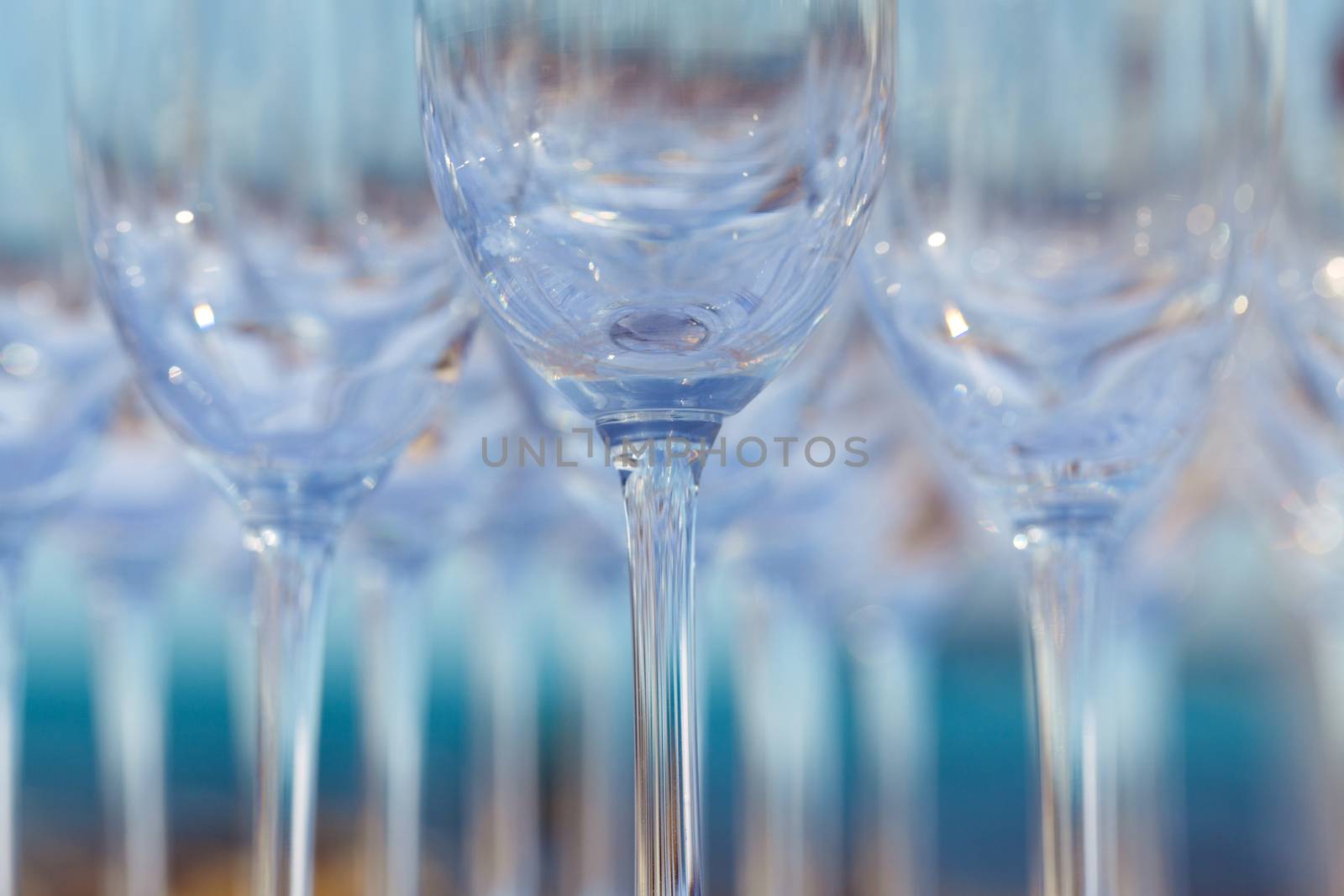 Empty wine glasses setting for wedding party.