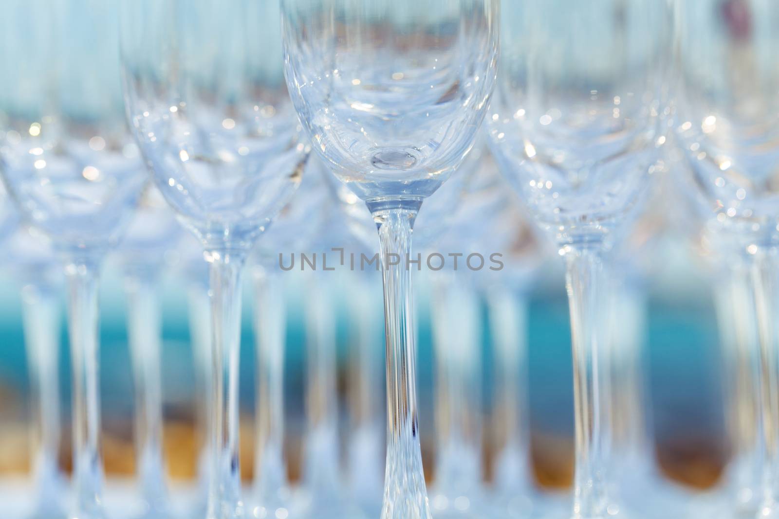 Empty wine glasses setting for wedding party.