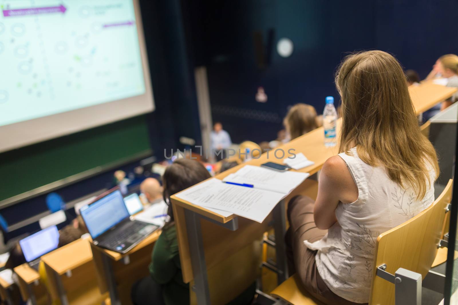 Audience in the lecture hall. by kasto