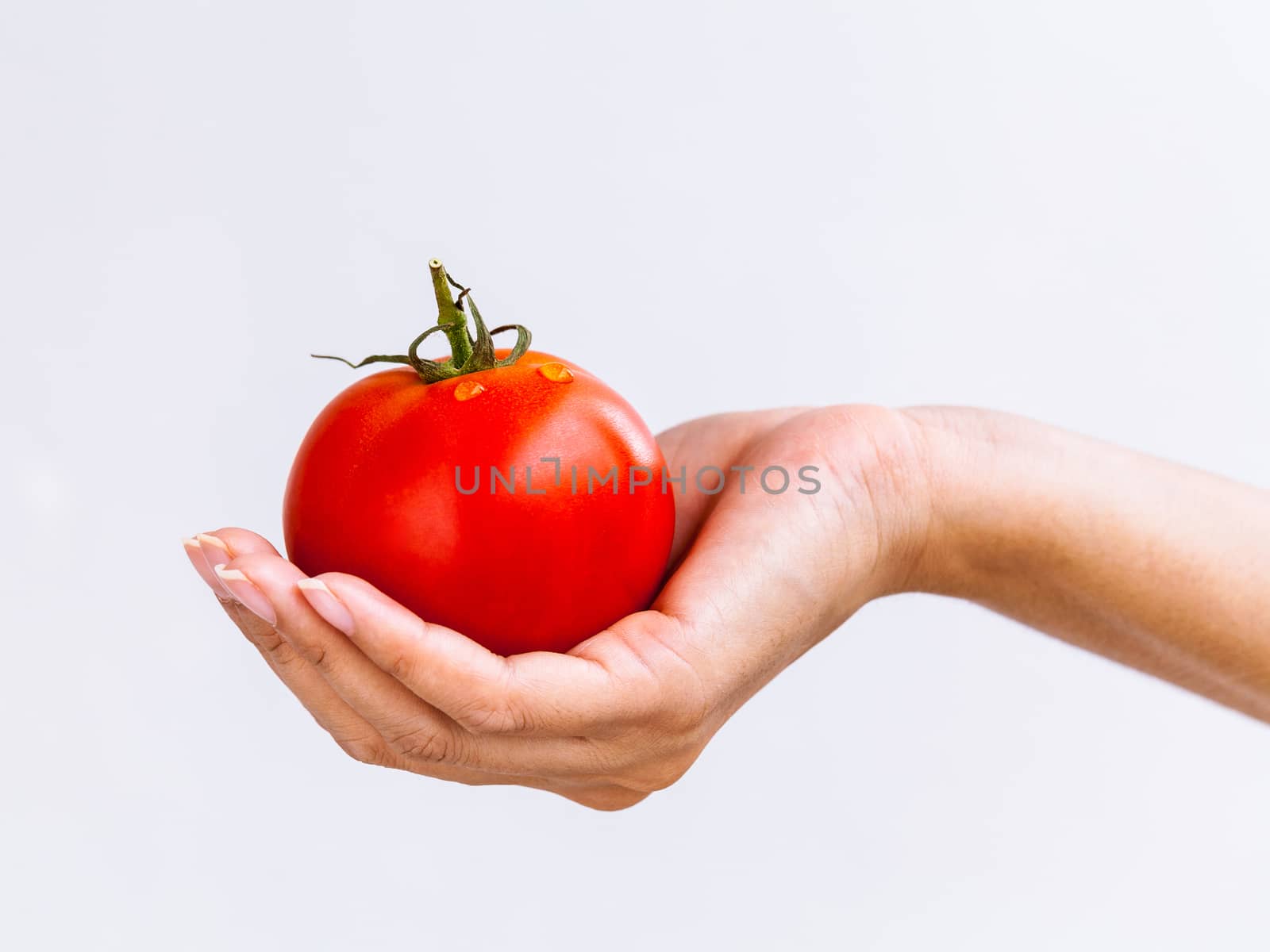 The Girl holding tomato. - Healthy food concept. by kerdkanno