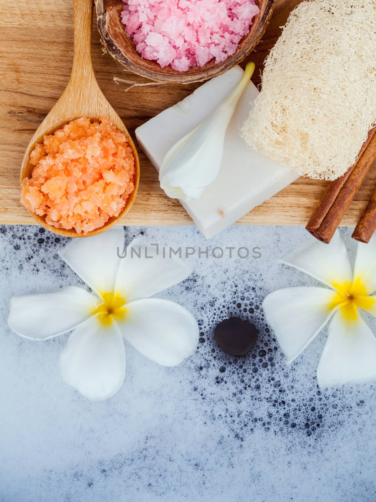 Spa and wellness treatment setup on wooden panel. by kerdkanno