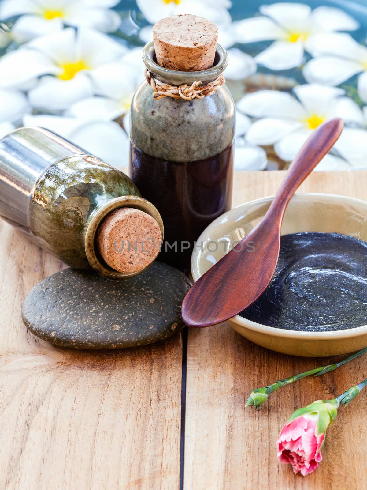 Spa and wellness treatment setup on wooden panel.