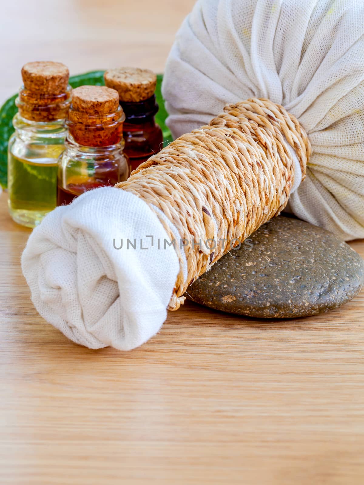 Natural Spa Ingredients . The herbal compress ball and massage oil for spa treatment.