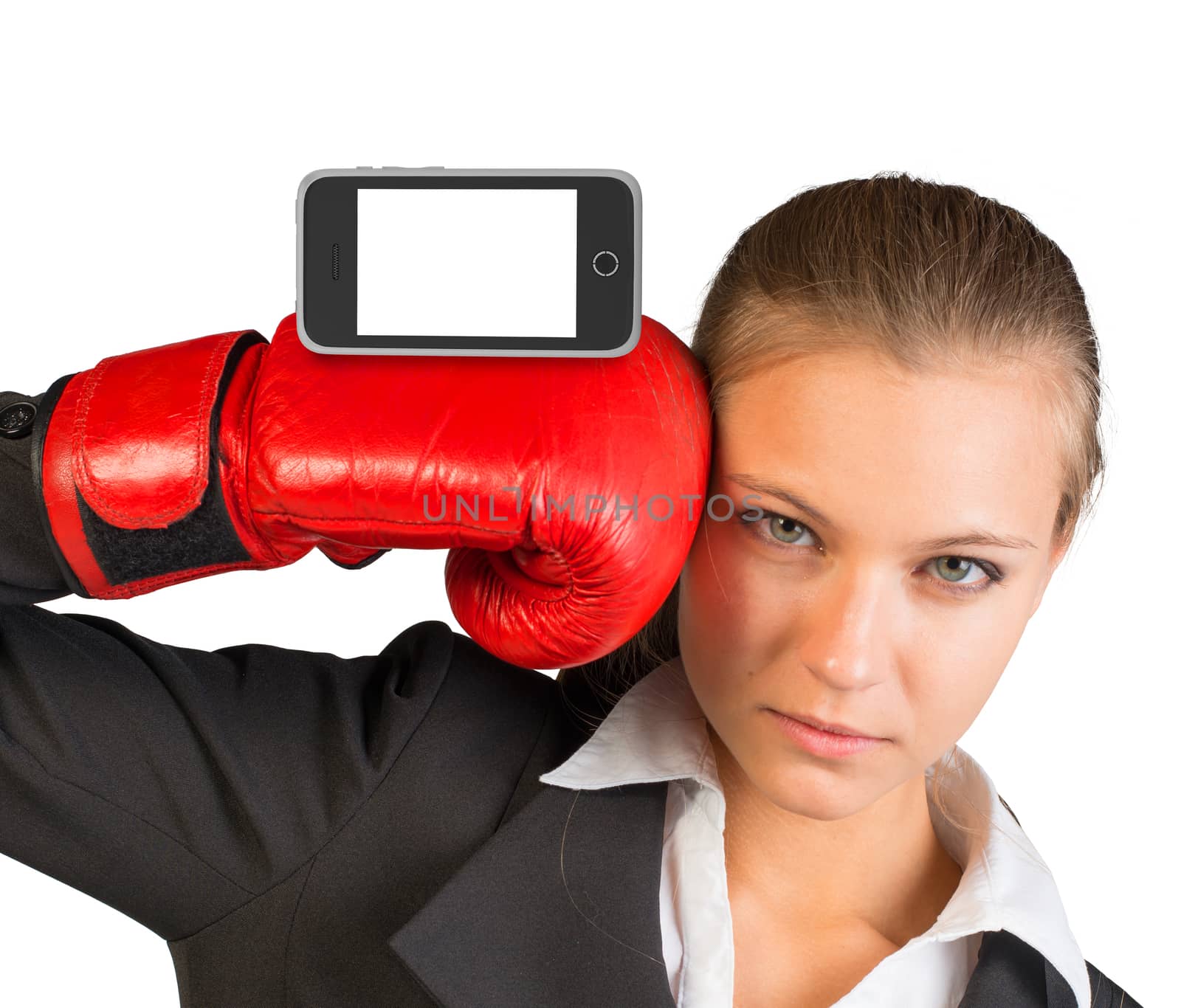 Businesswoman in boxing gloves with smartphone looking at camera on isolated white background
