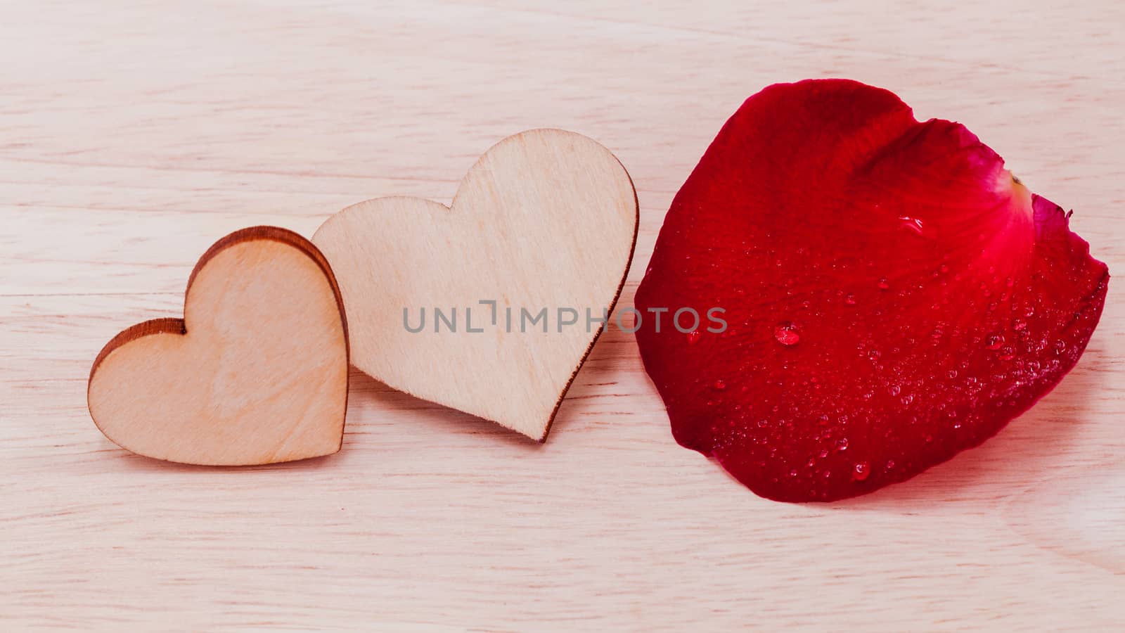 The wooden hearts on wooden background. - Concept for love and w by kerdkanno