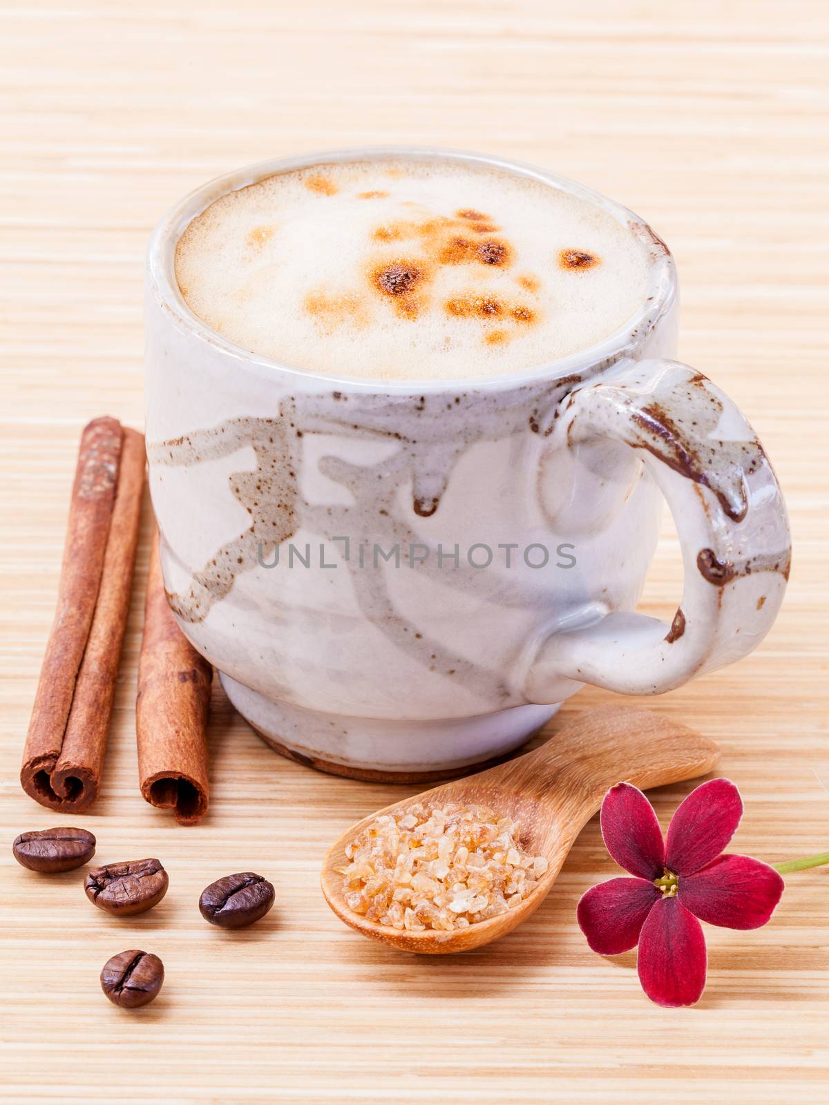 A cup of coffee on wooden background.