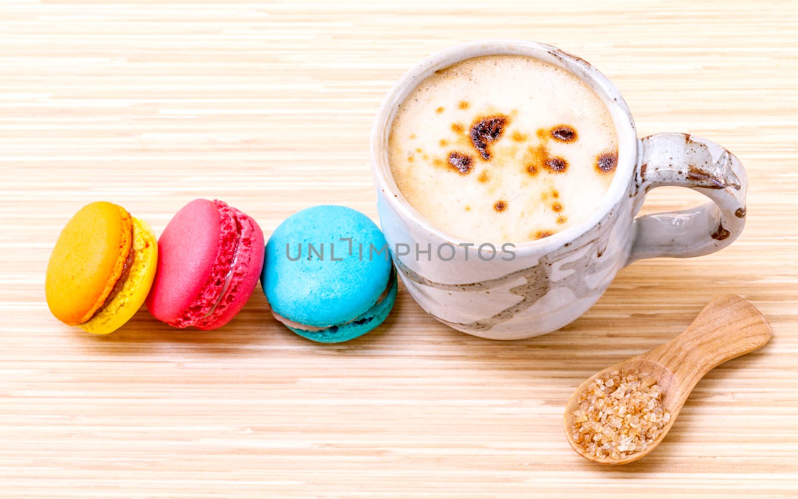 French colourful macaroons and a cup of coffee. - Macro shot wit by kerdkanno