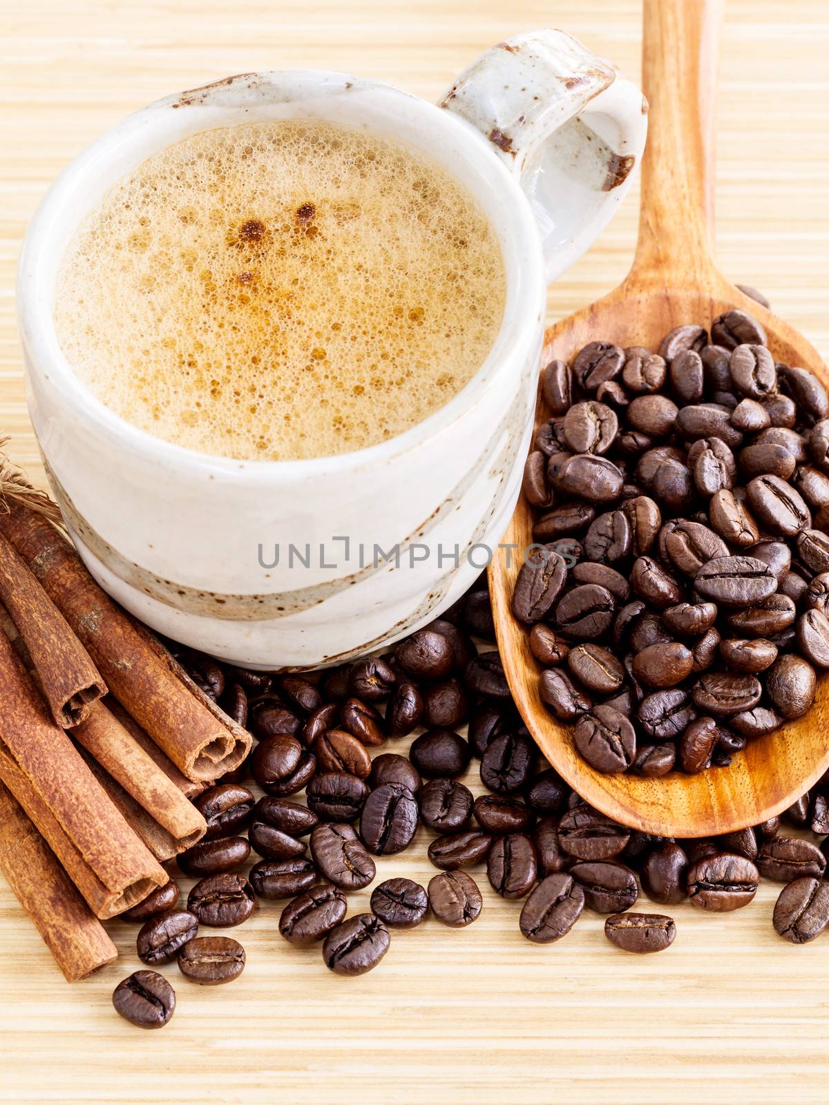 A Coffee cup and coffee beans on  wooden panel - With copy space,concept for Coffee and Aroma refreshing.