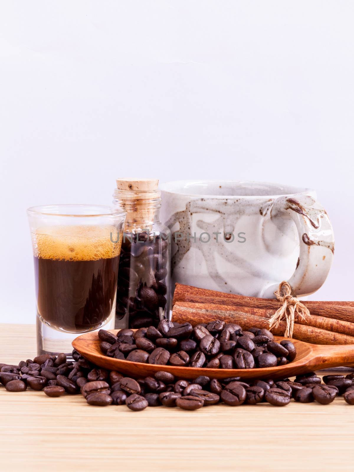 A Coffee cup and coffee beans on  wooden panel - With copy space,concept for Coffee and Aroma refreshing.