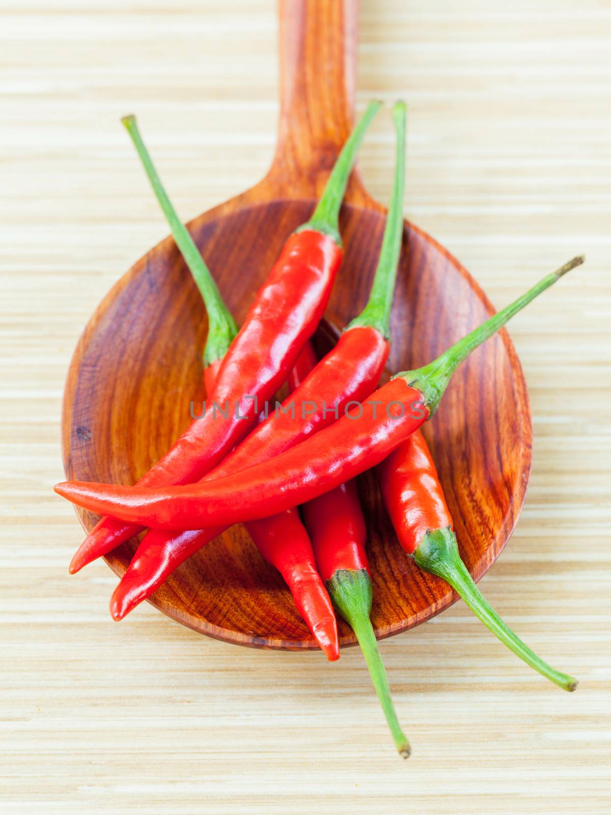 Cooking ingredients. - Chilli on wooden panel. by kerdkanno