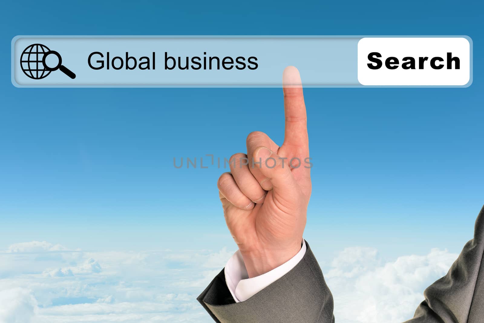 Businessmans hand on blue sky background with words global business in browser 