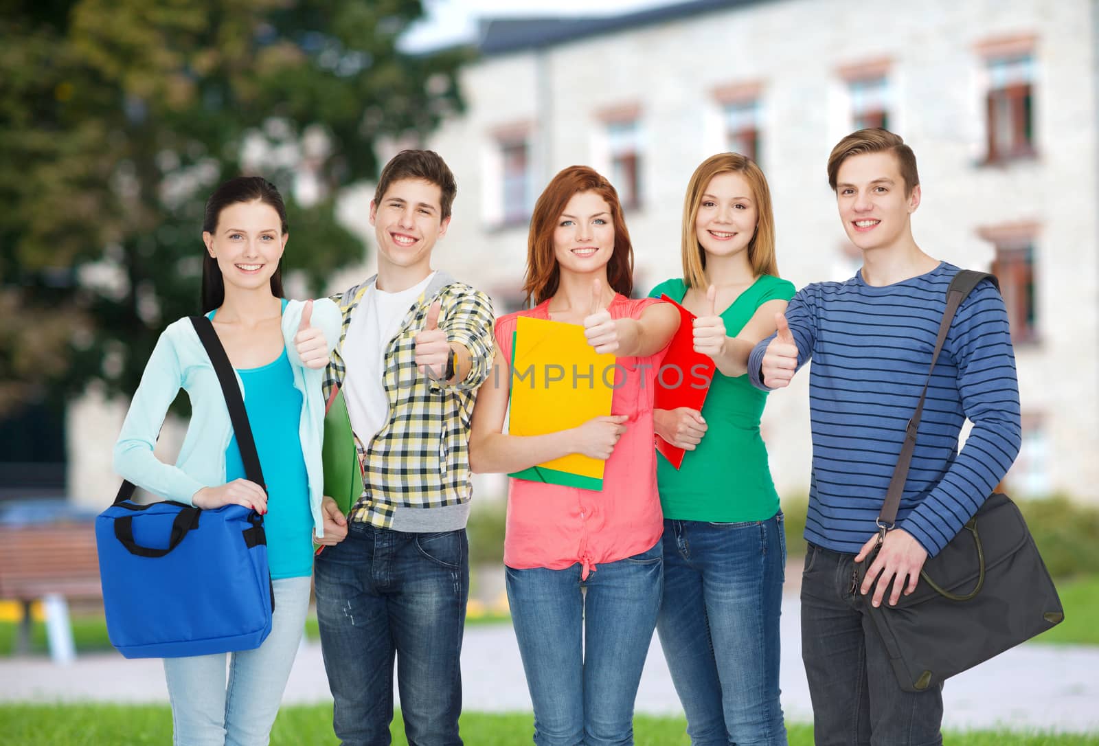 education and people concept - group of smiling students standing