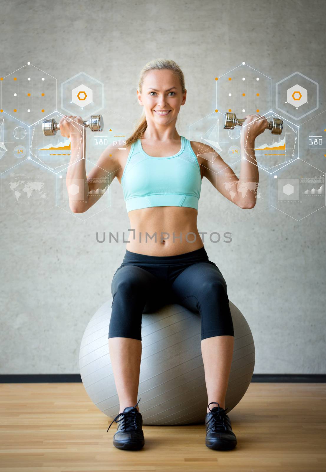 fitness, sport, training, future technology and lifestyle concept - smiling woman with dumbbells and exercise ball in gym and graph projection