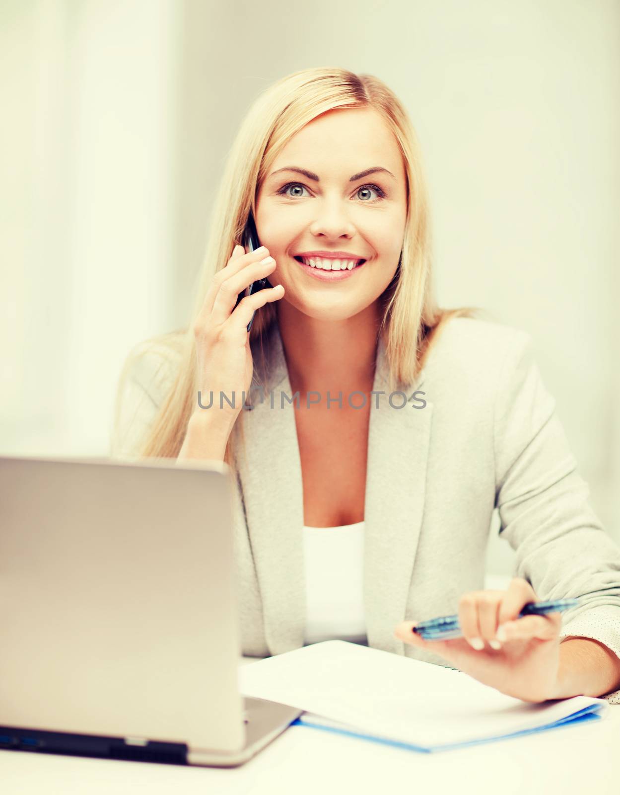 business and education concept - picture of businesswoman with laptop and cell phone